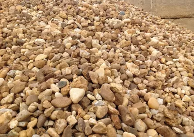 stack of 1 & 1/2 inch brown river rock for bulk purchase