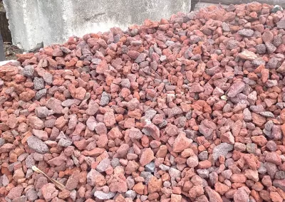 a large pile of red lava rock for bulk purchase